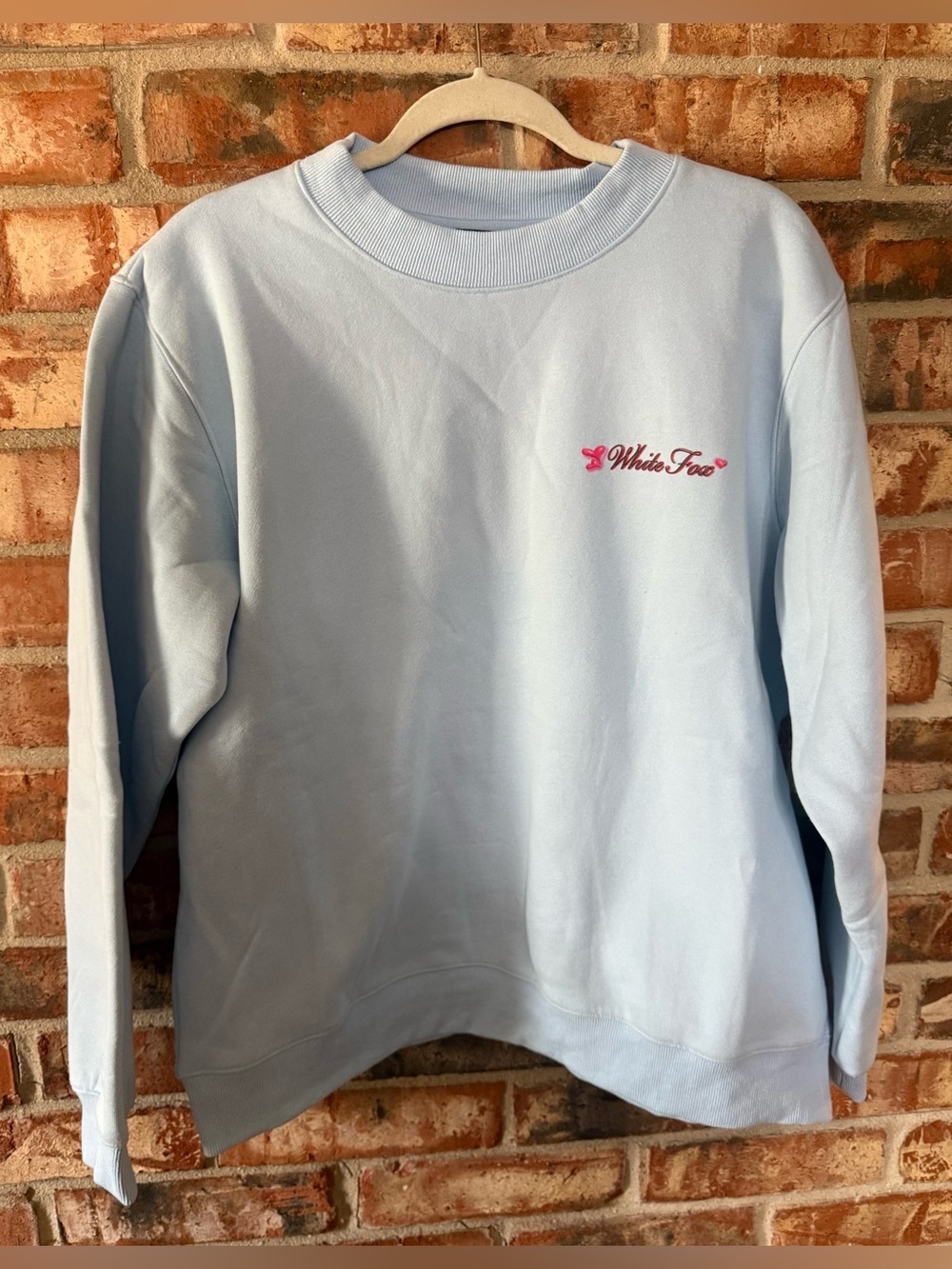 White Fox Boutique Pale Blue Crewneck with Pink Logo